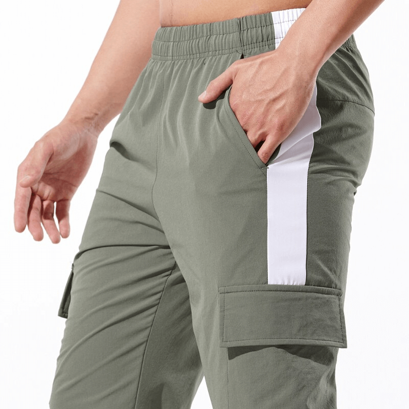Men's casual sports pants with large side pockets, elastic waistband, and full length design for comfort in running and exercise.